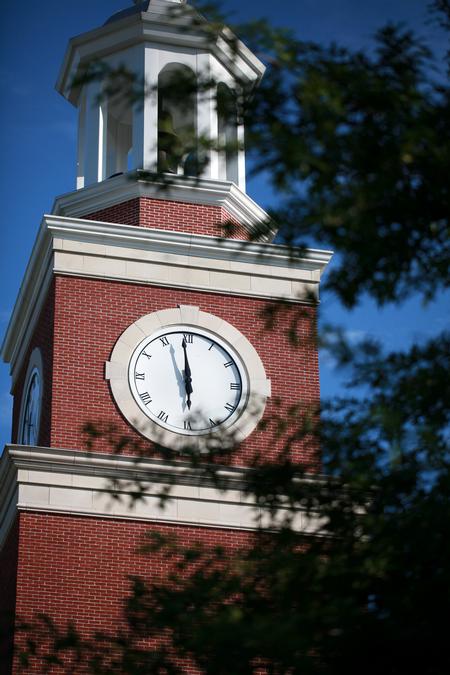 Miller Tower showing the time as graduates take their seats during spring graduation. - Photo by Kristi McMurry Woody