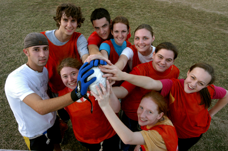 The champions of the first annual Turkey Bowl, <i>Dark Meat</i>, hoist the frozen fowl in celebration of their hard fought victories. Each player received a Union hoodie as a prize for their successful sweep of the competition. Pictured are sophomores (front, left) Joel Polk, Donna Reed, Erin Hale, Brooke Fowler, (back, left) Kyle Mathis, Aaron Perry, Toria Argo, Rachelle Haskins and Amanda Rushing. A catch in the end zone by Polk sealed the win. - Photo by Jonathan Blair