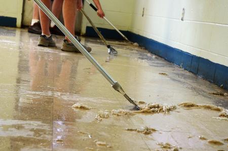 Union University volunteers removed nearly eight layers of wax from the cafeteria floor at Lloyd Wood Middle School in Northport, Ala. - Photo by Beth Spain