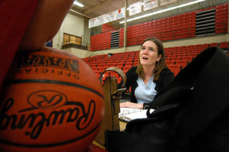 Cherry Johnson speaks with a Lady Bulldog basketball player during a practice.  Johnson has been the Lady Bulldog manager the past four years. - Photo by Jonathan Blair