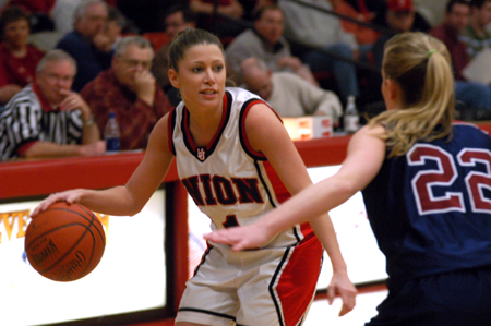 Union sophomore guard, Jennifer Henson (11) surveys the defense in a game versus Lyon College. - Photo by Jonathan Blair