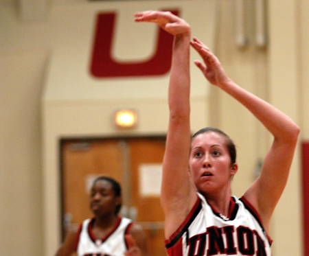 Union sophomore guard, Peggy McCain, follows through on a free shot attempt in the Lady Bulldogs' win over Lyon College.  Monica Elliot looks on. - Photo by Jonathan Blair