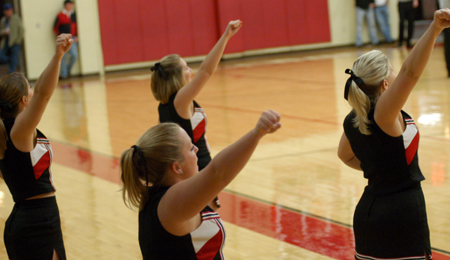 The Union University Cheerleaders performing on the sidelines during a game. - Photo by Jonathan Blair