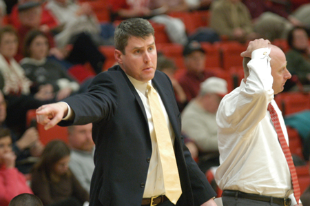David Niven, assistant coach for the men's basketball team, gives instructions to the players on the floor. - Photo by Jonathan Blair