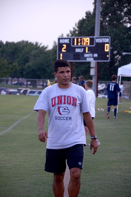 Clovis Simas, head soccer coach, paces the sidelines while bringing Union University men's soccer team to a win over Wallace State Community College, 4-1.  - Photo by Ebbie Davis