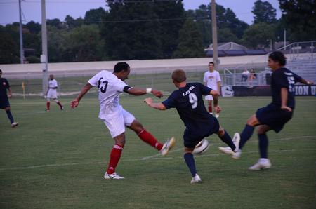 Diego Santos fights for possession against defenders.  Union University men's soccer team opened off the season with a win over Wallace State Community College, 4-1. 
 - Photo by Ebbie Davis