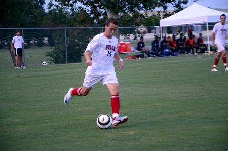 Guilherme Elvira dribbles toward the goal in the opening game of the soccer season. The bulldogs defeated Wallace State Community College, 4-1.  - Photo by Ebbie Davis