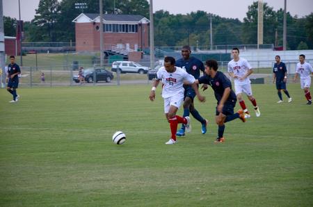 Diego Santos fights for possession against defenders.  Union University men's soccer team opened off the season with a win over Wallace State Community College, 4-1.  - Photo by Ebbie Davis