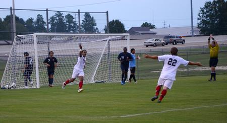 Diego Santos and Cooper Rawls celebrate after the bulldogs score a goal in the opening game of the season against Wallace State Community College.

 - Photo by Ebbie Davis