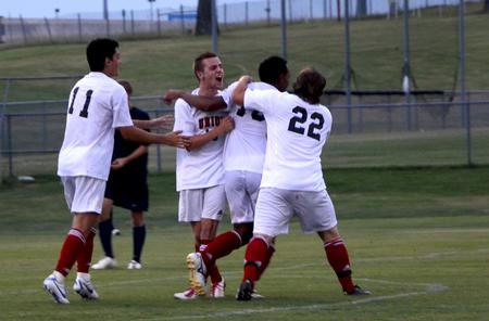 Diego Santos and his teammates celebrate after he scored a goal for the bulldogs.  - Photo by Ebbie Davis