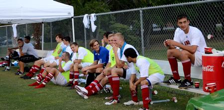 Bulldog soccer players watch as their teammates play Wallace State Community College.  - Photo by Ebbie Davis