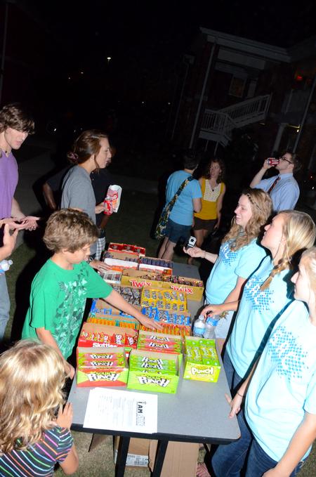 SAC serves candy during Movie on the Lawn in the residence life complex. - Photo by Ebbie Davis