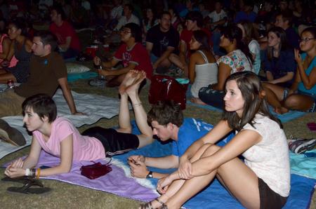 Students enjoy a movie presented in the Watters quad during Movie on the Lawn.  - Photo by Ebbie Davis