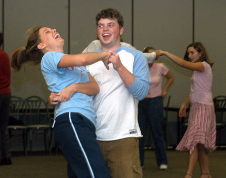 Junior Lauren Oldham and Junior Brandon Nelms practice some newly acquired moves during an educational class on swing dancing at Swing Nite. - Photo by Jonathan Blair