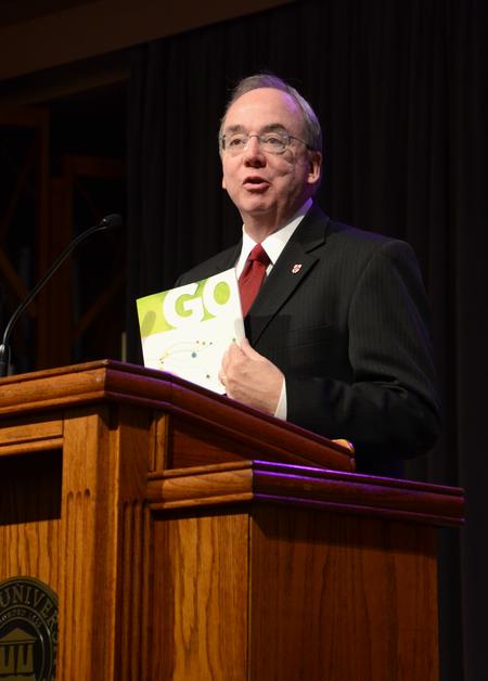 David Dockery, president of the university, speaks on the opportunities available through GO mission trips during chapel. - Photo by Jacob Moore