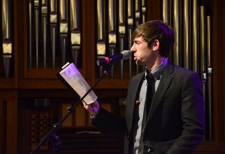 Brad Carrington, senior church music major, reads a passage from Romans during chapel. - Photo by Jacob Moore