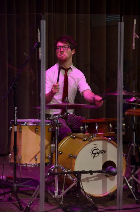 Aaron Beasley, graduate assistant to the Office of Spiritual Life, plays drums during Family Weekend chapel. - Photo by Jacob Moore