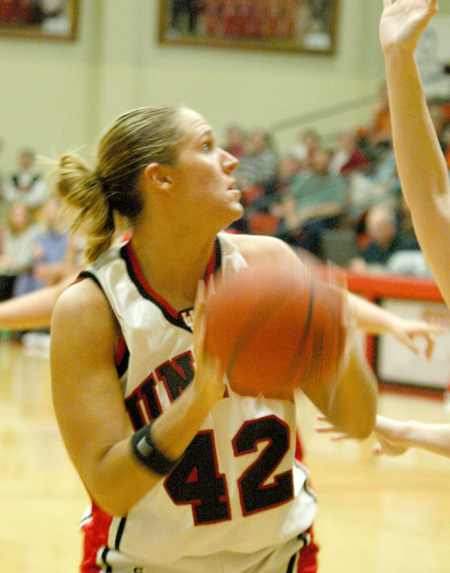 Senior forward Ginger Bryant turns to shoot over a Martin Methodist defender. - Photo by Steven Aldridge