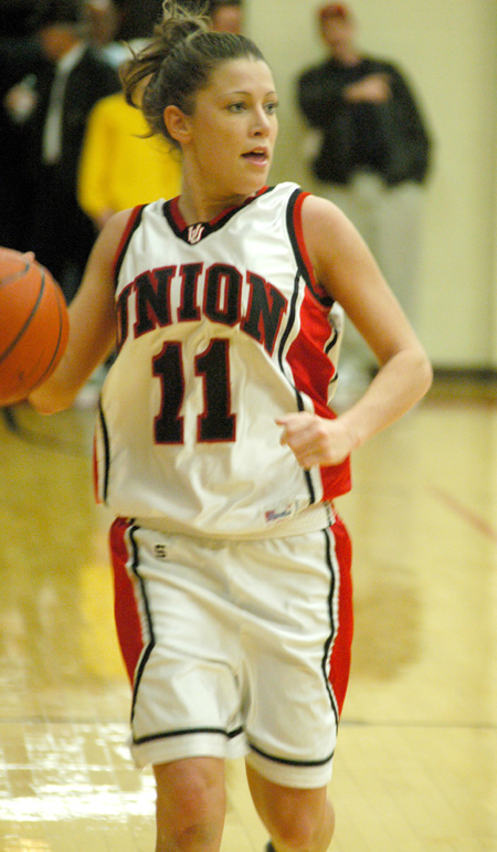Jennifer Henson looks over the defense as she brings the basketball up the floor. - Photo by Steven Aldridge