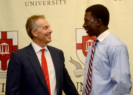 Keynote speaker Tony Blair, former British Prime Minister, greets Union freshman Bangali Sillah while discussing common interests about his home in Sierra Leone. - Photo by Ebbie Davis