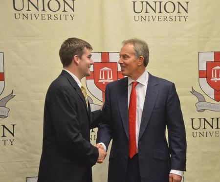 Former British Prime Minister Tony Blair visits with Ben Dockery after the Scholarship Banquet. - Photo by Morris Abernathy