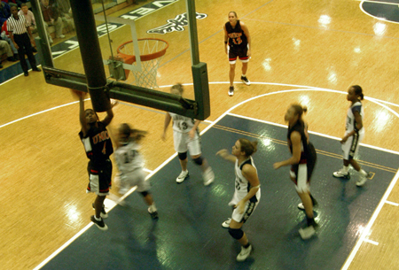 Latorya Fuller (4) drives in for a layup in Union's win at Lambuth.   - Photo by Jonathan Blair