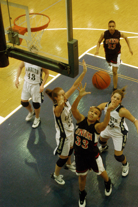 Stephanie Clark (33) goes up for a rebound in Union's win at Lambuth Unviersity. - Photo by Jonathan Blair