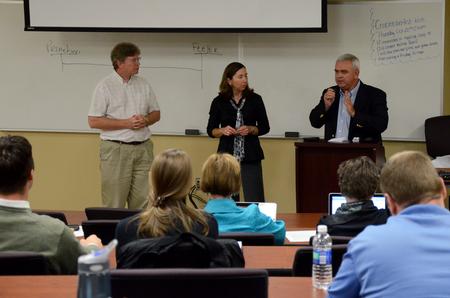 Mark Bolyard, chair of the department of biology, Melody Harper, campus strategist, and Patrick Melancon, managing director of disaster response and training for Baptist Global Response, answer questions at the Town and Gown lecture series.  - Photo by Anne Richoux