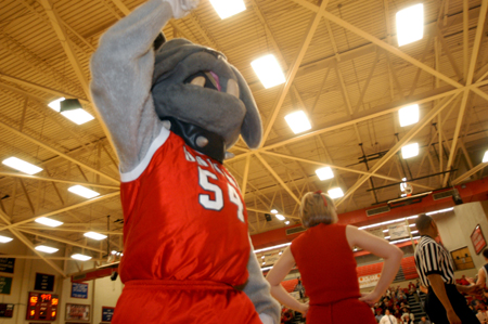 Buster the Bulldog joins forces with the cheerleaders and the home crowd during basketball games. He can be found roaming around the gym, rousing the crowd and playing with children. - Photo by Jonathan Blair