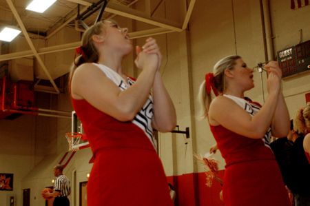 Senior captain Aleica Robertson (front) leads the cheerleaders during a Union ballgame. - Photo by Jonathan Blair