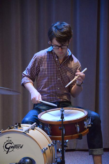 Aaron Beasley, graduate assistant to the Office of Spiritual Life, plays drums before Poly Rouse speaks in chapel. - Photo by Zac Calvert