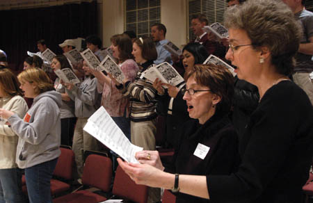 Former roommates Beverly Vowell Grant (’78) and Nancy Warlick Carnes (’78) sing together at the Proclamation Reunion during Homecoming 2004.  As a student Nancy sang in Proclamation. - Photo by Jim Veneman