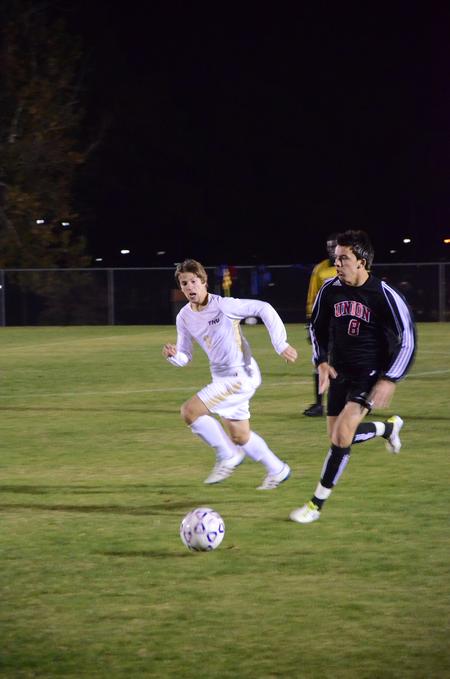 Kemal Gogic dribbles the ball and scores in the last match of the season against Trevecca Nazarene University. - Photo by Zac Calvert