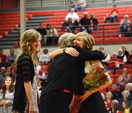 Lanese Dockery, first lady of the university, congratulates Andi Schreiber, senior family studies major, on winning homecoming queen for 2011. - Photo by Zac Calvert