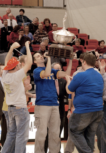 The men of Alpha Tau Omega celebrate their Homecoming Cup 2004 victory. - Photo by Lindsay Stavish