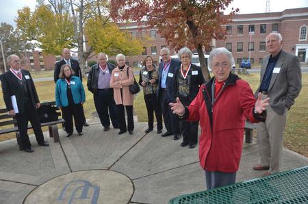 Ramona Mercer, a retired missionary and friend of Union University,  gives the class of 1962 a walking tour of Union's previous campus downtown. - Photo by Morris Abernathy