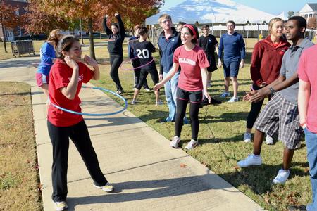 Josselyne Bustillo, freshman political science major, participates in a hula-hoop competition during Homecoming Olympics.
 - Photo by Jacob Moore