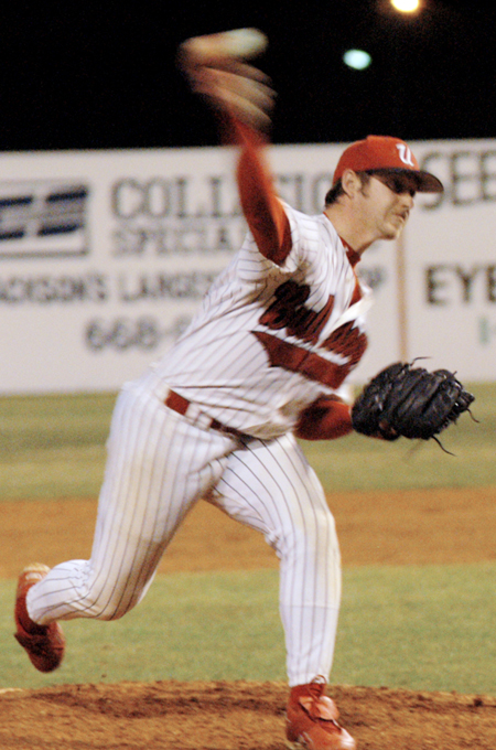 Senior pitcher Nash Powell, physical education and health major, pitches in a night game at Union's Fesmire Field. - Photo by Jonathan Blair