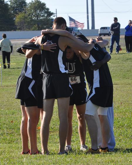 Union Cross Country prays before a meet. - Photo by Steven Aldridge