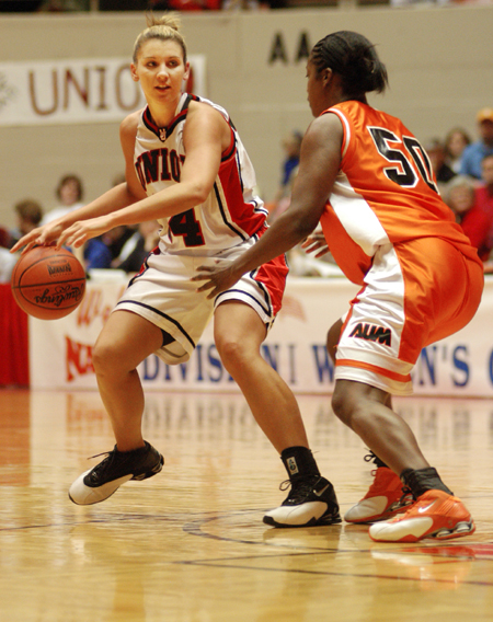 Junior forward Molly York (34) eyes her options against a tough Auburn-Montgomery defense. - Photo by Kristen Nicole Sayres