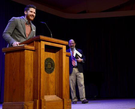 Lee Wilson, director of discipleship, introduces Scott Huelin, director of the honors community and associate professor of English, to speak in chapel. - Photo by Ebbie Davis