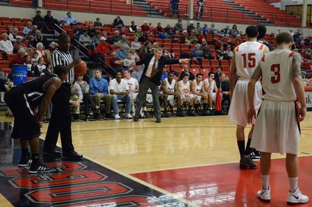 David Niven, head men's basketball coach, calls out plays during a game against Cambellsville University. - Photo by Anne Richoux