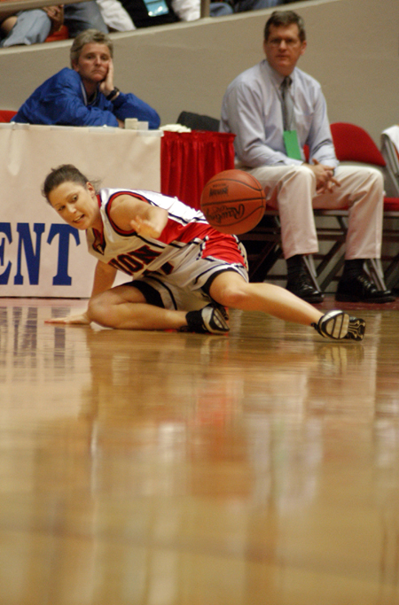 Jennifer Henson keeps the ball in play after falling to the floor during the NAIA National Tournament. - Photo by Kristen Nicole Sayres
