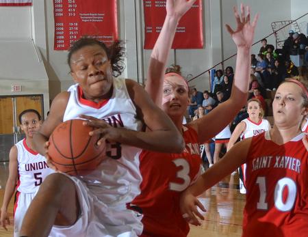 Despite heavy pressure from Saint Xavier Union's Lavanda Ross was able to score points at will. - Photo by Morris Abernathy