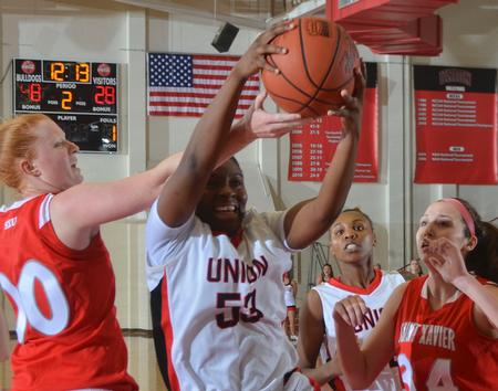 Union's Lavanda Ross comes down with the rebound during the Rotary Classic game with Saint Xavier. - Photo by Morris Abernathy