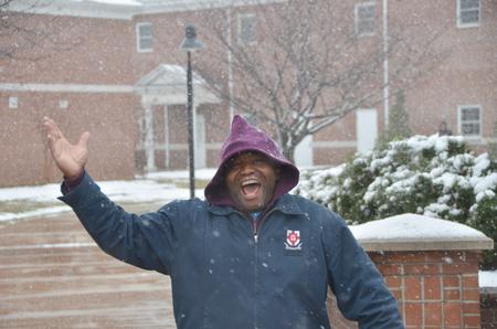 Housekeeping Supervisor Gene Hunt says good morning while the snow falls.  - Photo by Morris Abernathy
