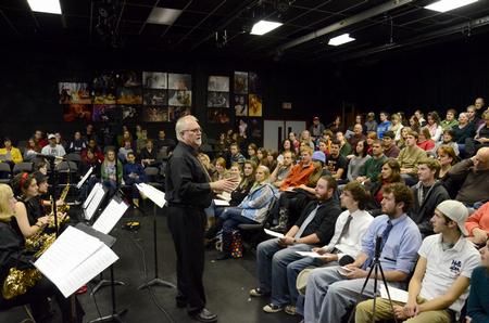 David McClune, university professor of music, welcomes the audience to the Fall 2011 Jazz Band Concert held in the W.D. Powell Theatre. - Photo by Jacob Moore
