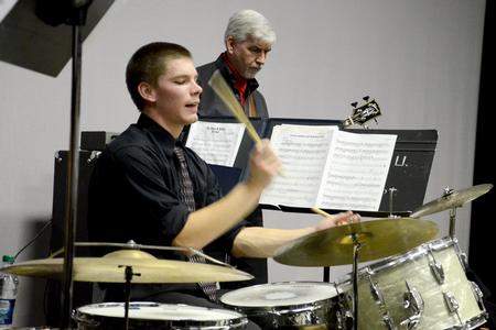 Jason Kriaski, senior philosophy major, plays drums and Bill Nettles, professor of physics and department chair, plays bass during the Fall 2011 Jazz Band Concert. - Photo by Jacob Moore