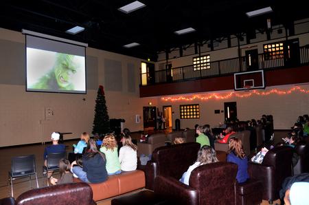 Students sit in the Bowld Student Commons to watch How the Grinch Stole Christmas during SAC's Movie in the Bowld. - Photo by Zac Calvert