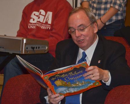 Students gathered in the McAfee commons to hear David S. Dockery  read the Christmas story. This is one of the tradition's during the last weeks of the semester here at Union. David Dockery reads The Night Before Christmas. - Photo by Morris Abernathy